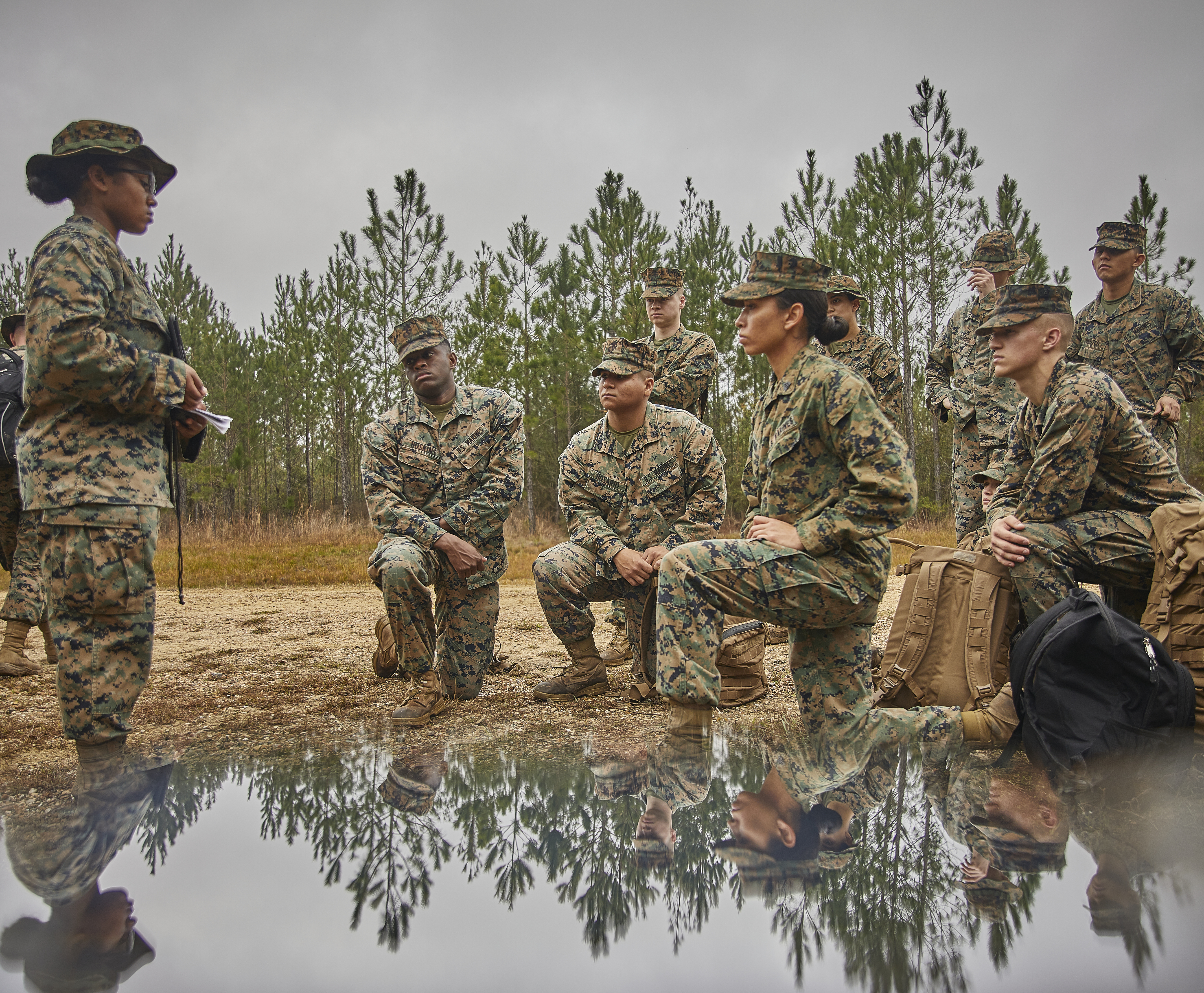 Marines with Marine Corps Support Facility New Orleans watch a resiliency training video between events during a field exercise at Camp Villere, Slidell, Louisiana, March 12, 2020.
