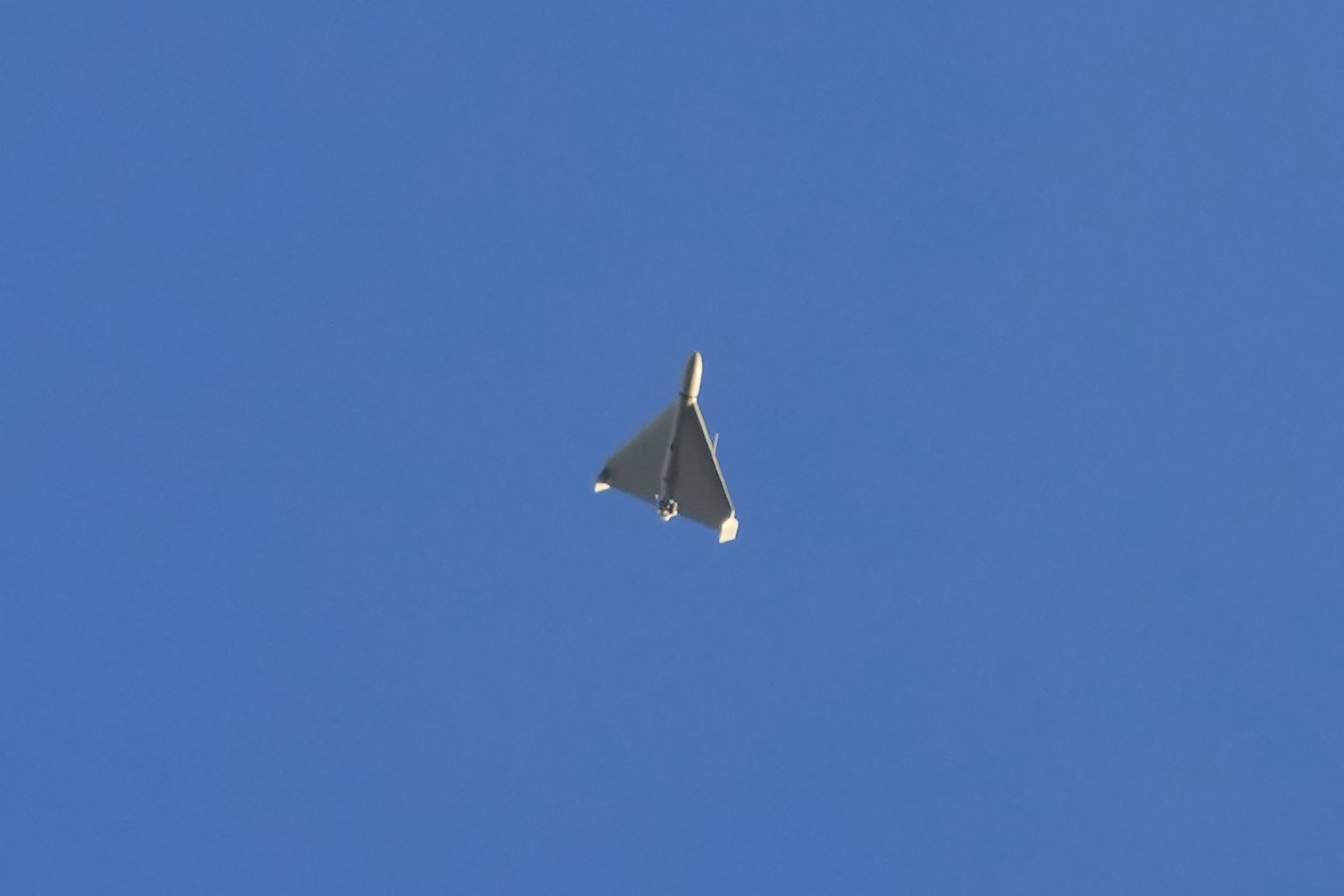 A drone is seen in the sky seconds before it fired on buildings in Kyiv, Ukraine, Monday, Oct. 17, 2022.