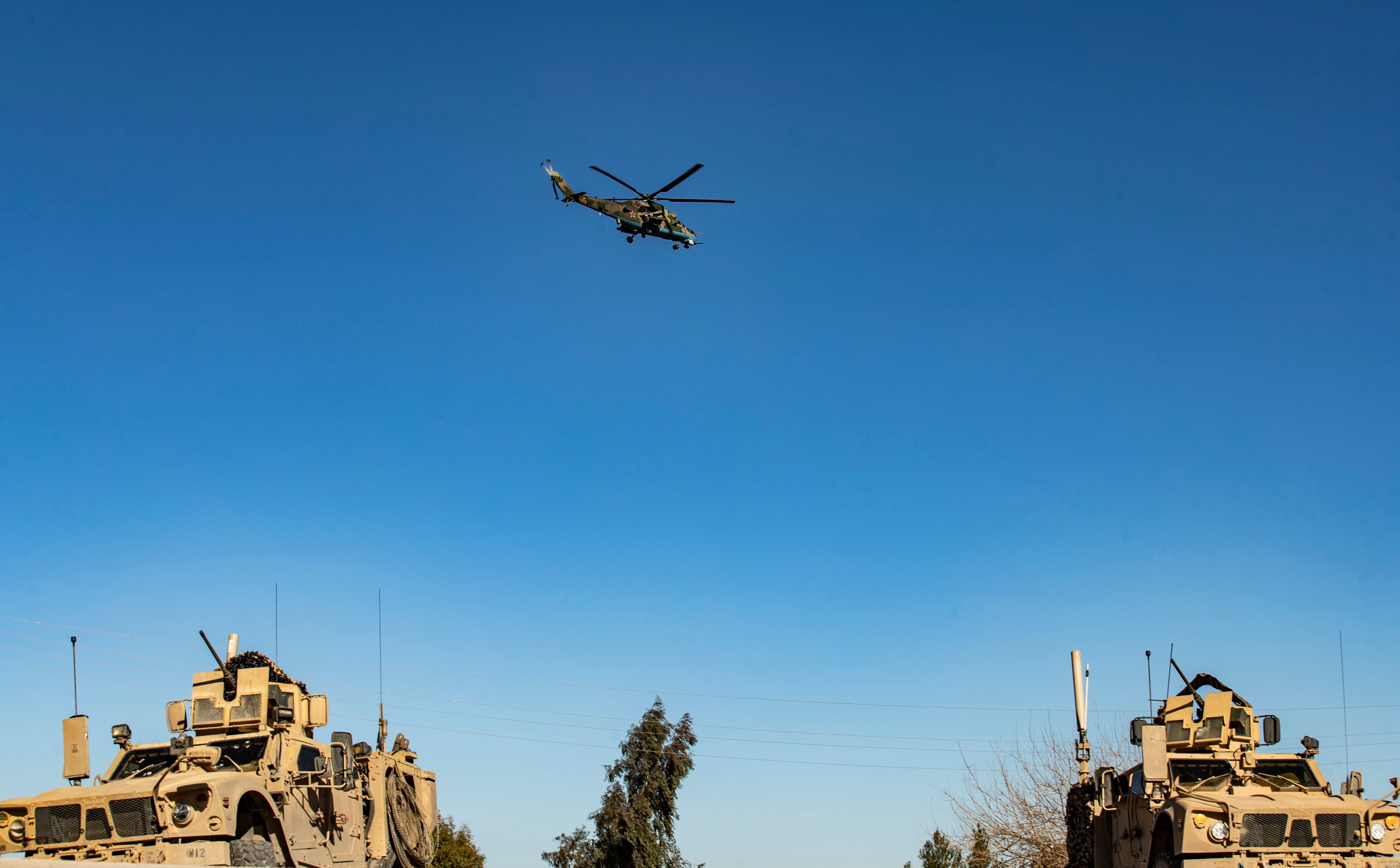 Russian army helicopter, US vehicles, Syria